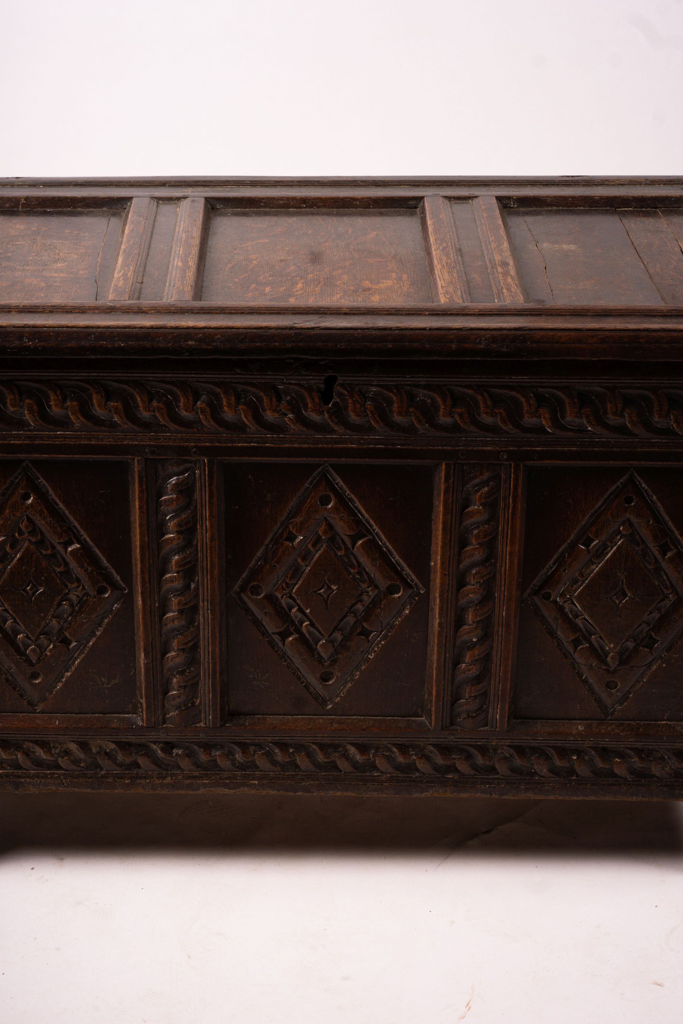 A 17th century carved panelled oak coffer, length 115cm, depth 56cm, height 67cm